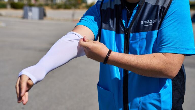 An image of an Amazon employee wearing a cooling sleeve.