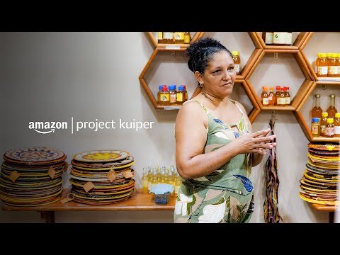 Woman sitting and working on crafted baskets