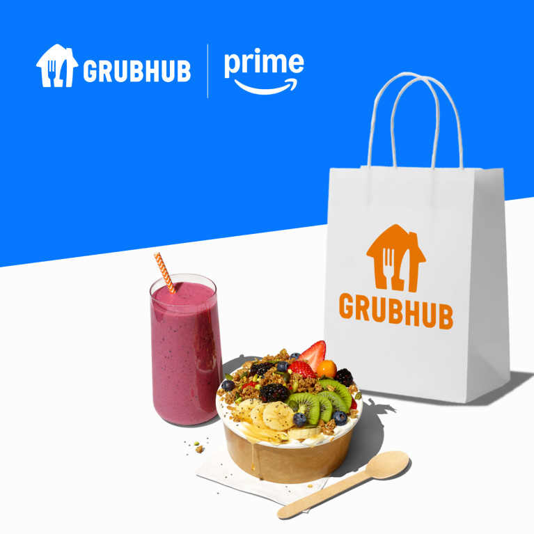 An image of a smoothie, a fruit bowl, a paper bag that reads Grubhub and branded text that reads Grubhub Prime.