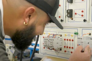 An image of an engineering operations technician working at Amazon.