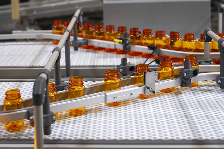 Amazon pharmacy prescription bottle in a fulfillment center.