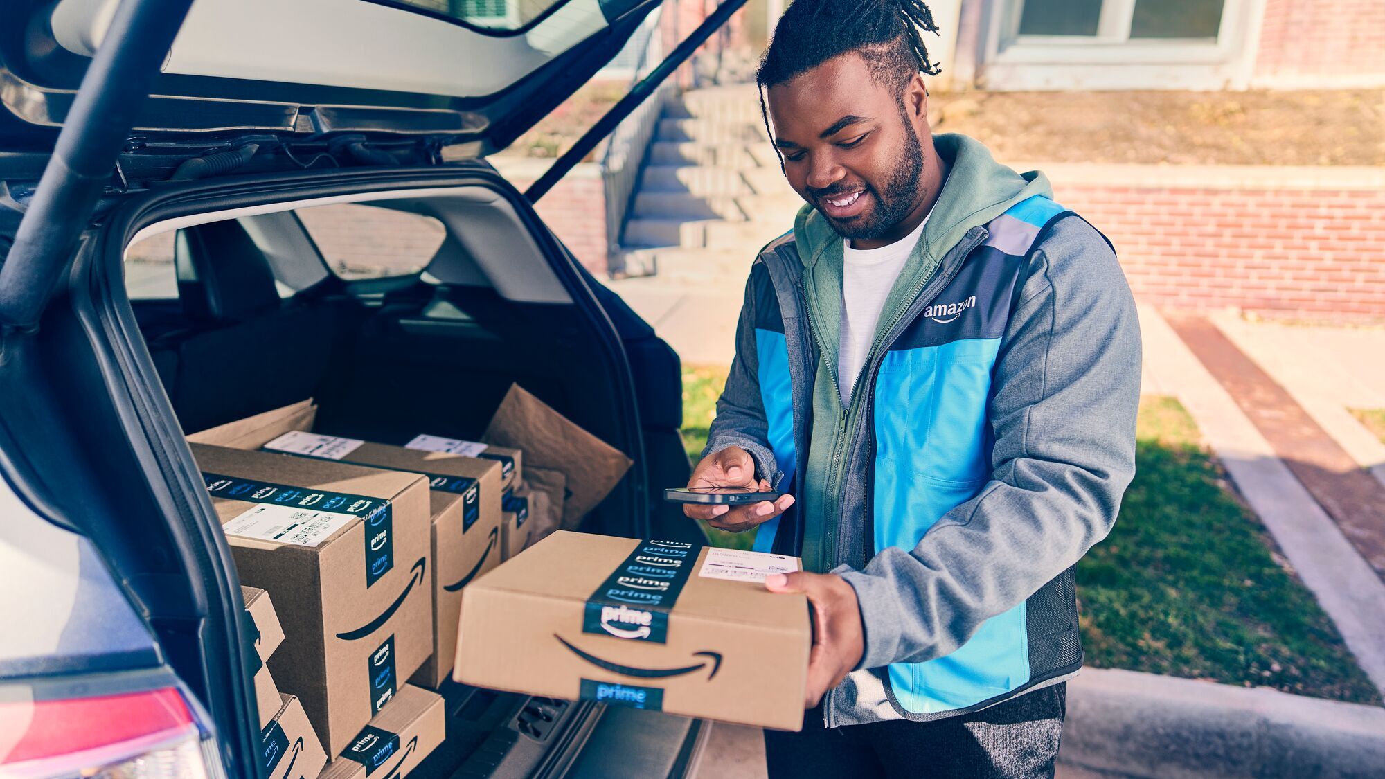 Amazon delivery driver delivers a package to a customer.